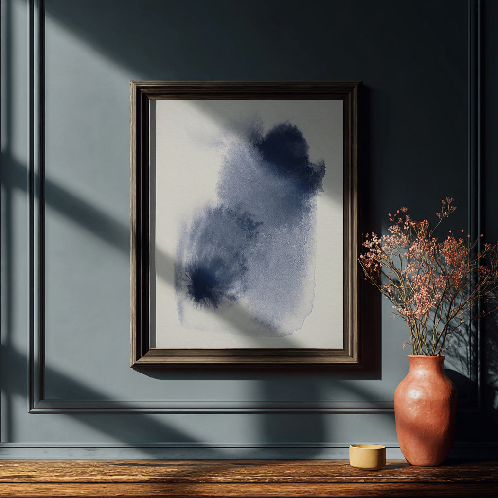 Framed abstract art piece on a wall.