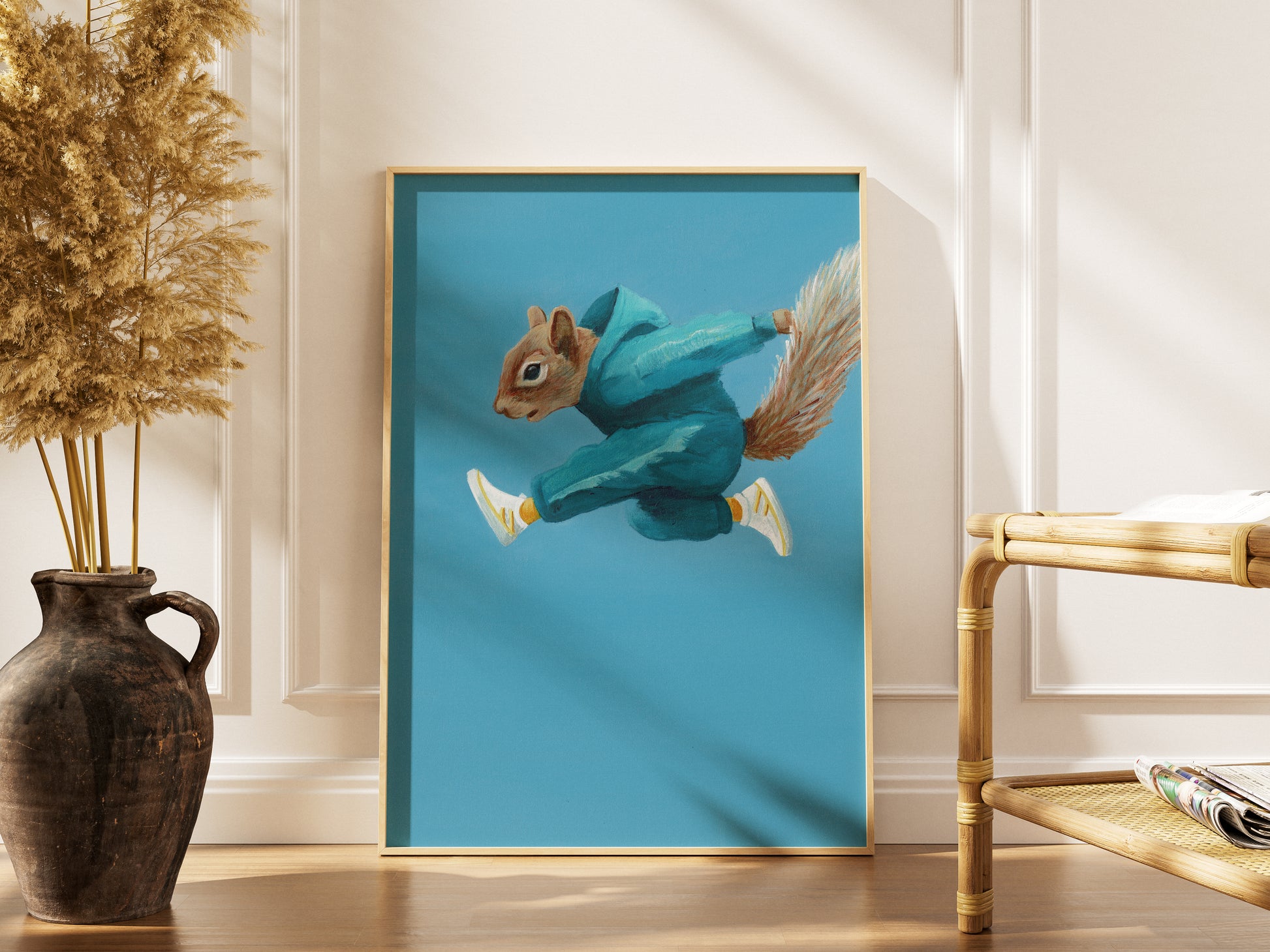 Framed artwork of a squirrel jumping in a blue tracksuit on a blue background