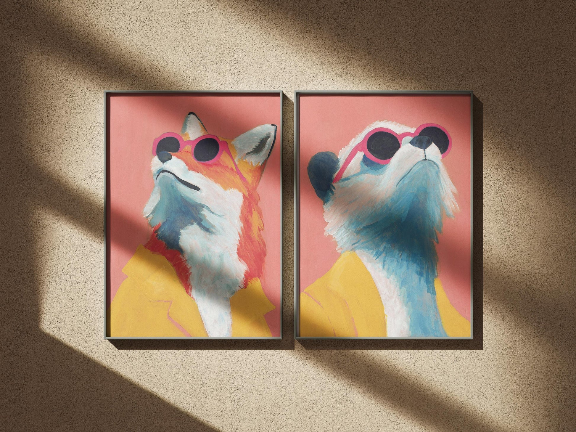 Two framed artworks of a fox wearing sunglasses and a yellow jacket on a pink background.