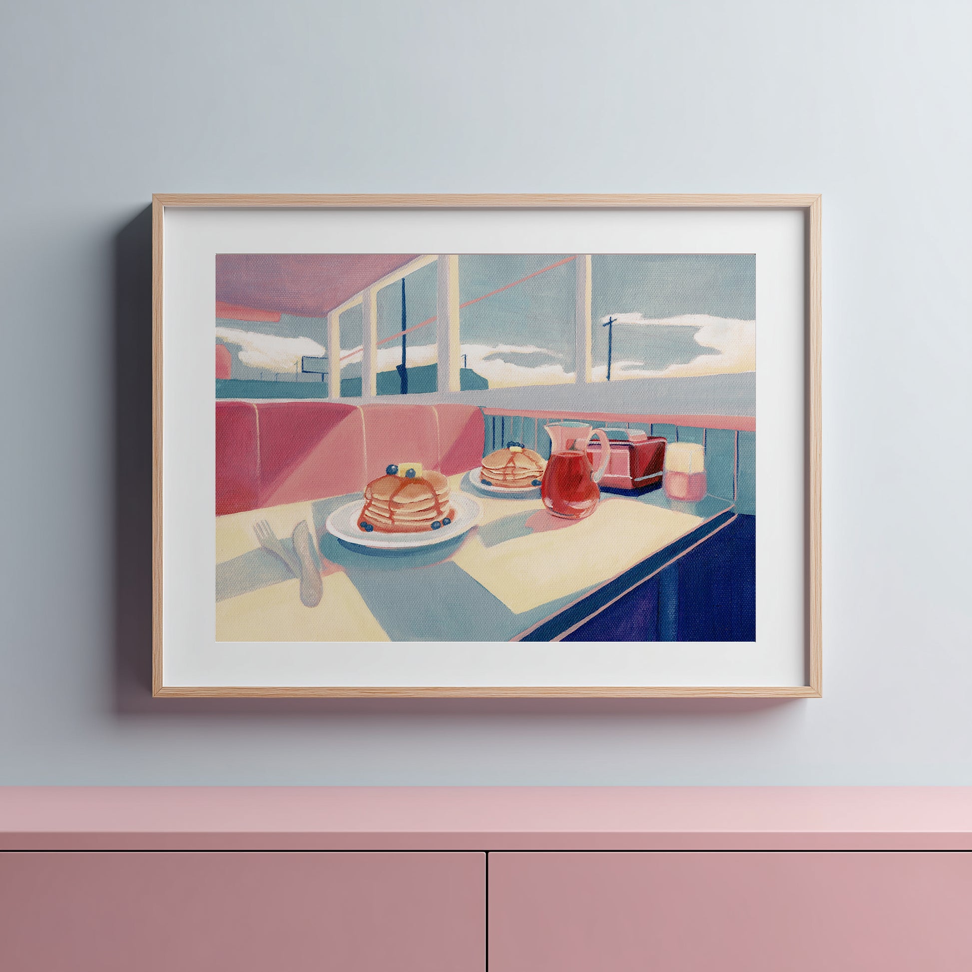 diner scene with pancakes on a counter.